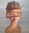 boiled wool cloche with plastic visor veil and leather applications - frontal view