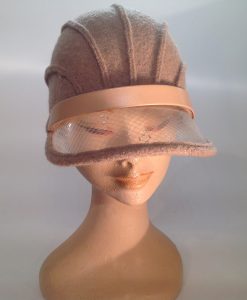 boiled wool cloche with plastic visor veil and leather applications - frontal view