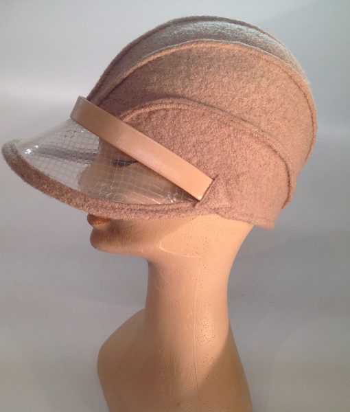 boiled wool cloche with plastic visor veil and leather applications - side view